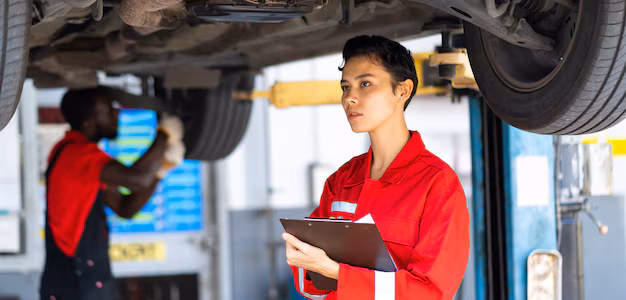 empowering-caucasian-waman-mechanic-wearing-red-uniform-working-vehicle-car-service-station